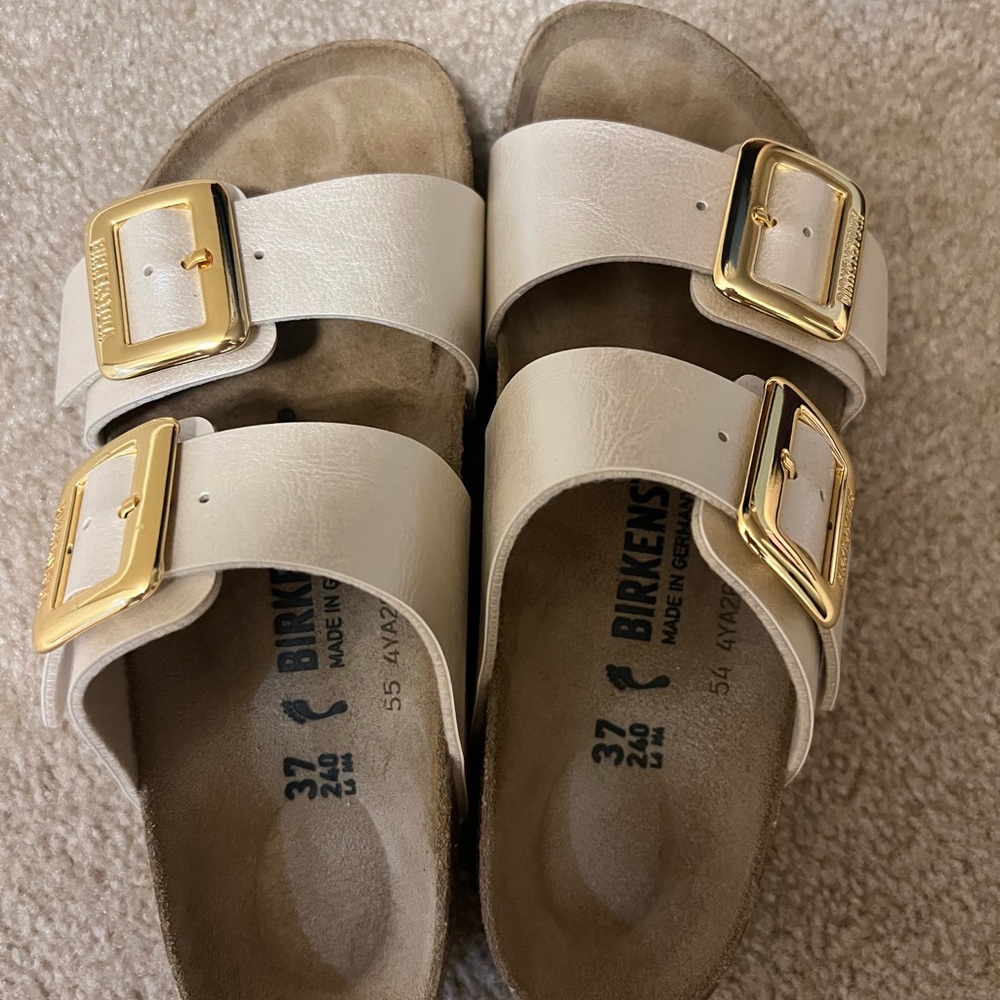 Birkenstock Cream Sandals with Gold Accents